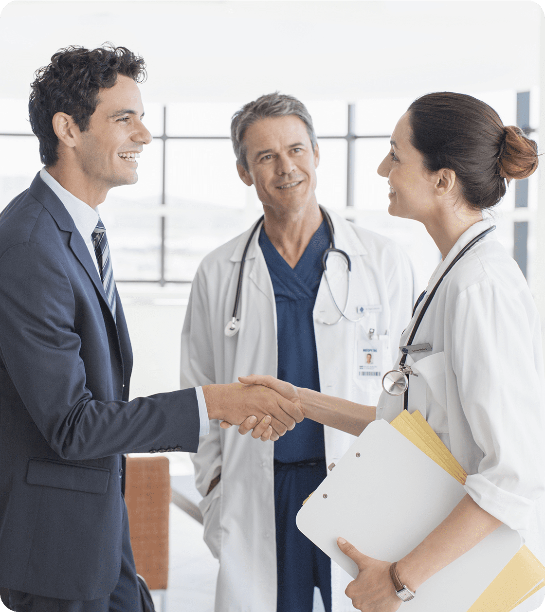 Businessman and doctors shaking hands