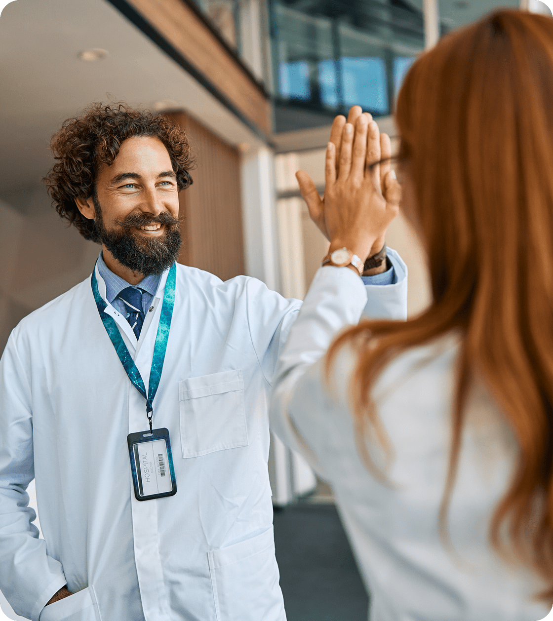 Happy healthcare workers high-fiving