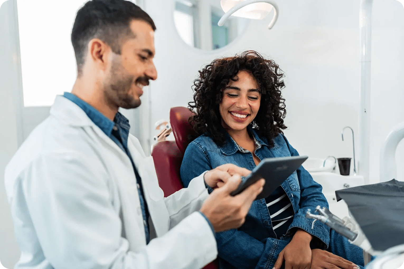 Dentist and patient discussing treatment plan