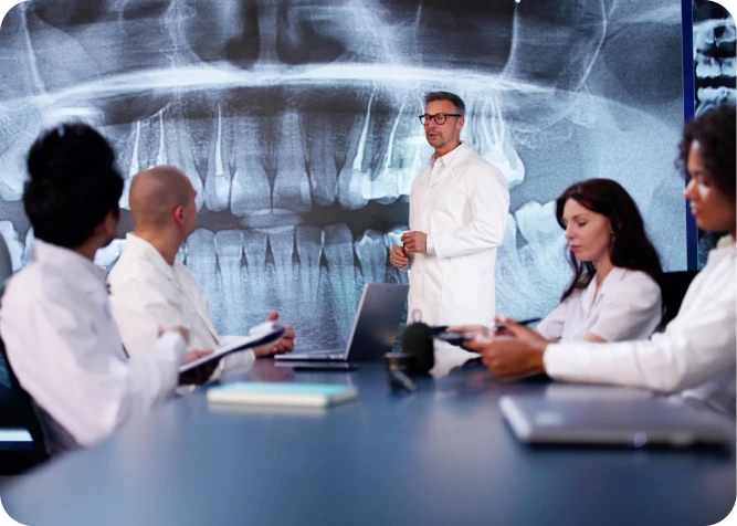Doctors discussing X-ray results in meeting