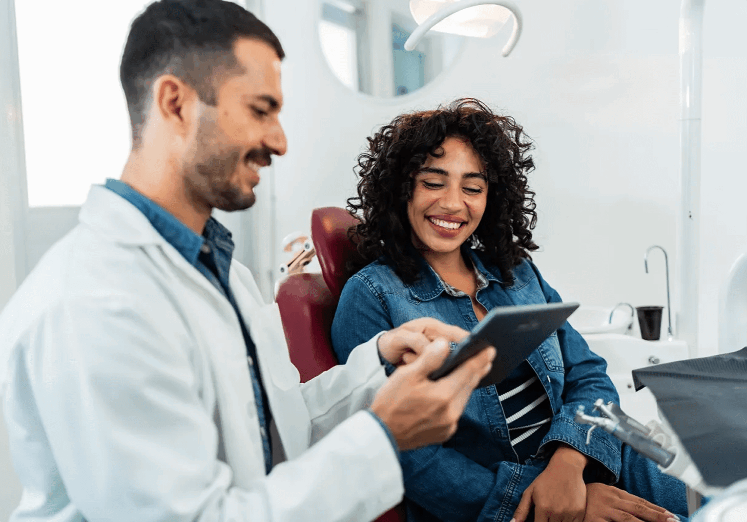 Dentist and patient discussing treatment plan